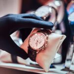 From classic to contemporary: exploring luxury watch styles 3 close up of the seller s hand in gloves shows the 2023 11 27 05 11 13 utc